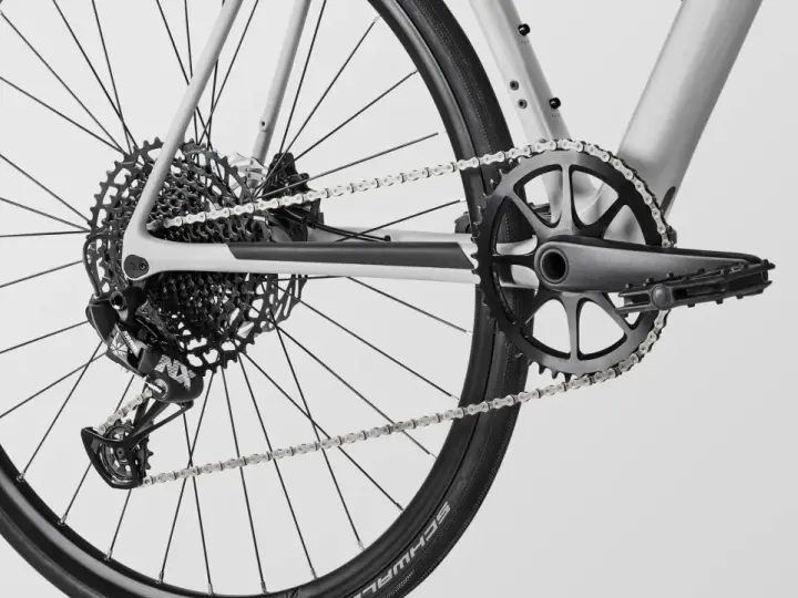 Close-up of a modern MTB drivetrain, featuring a SRAM rear derailleur, a wide-range cassette, and a single-chainring crankset.